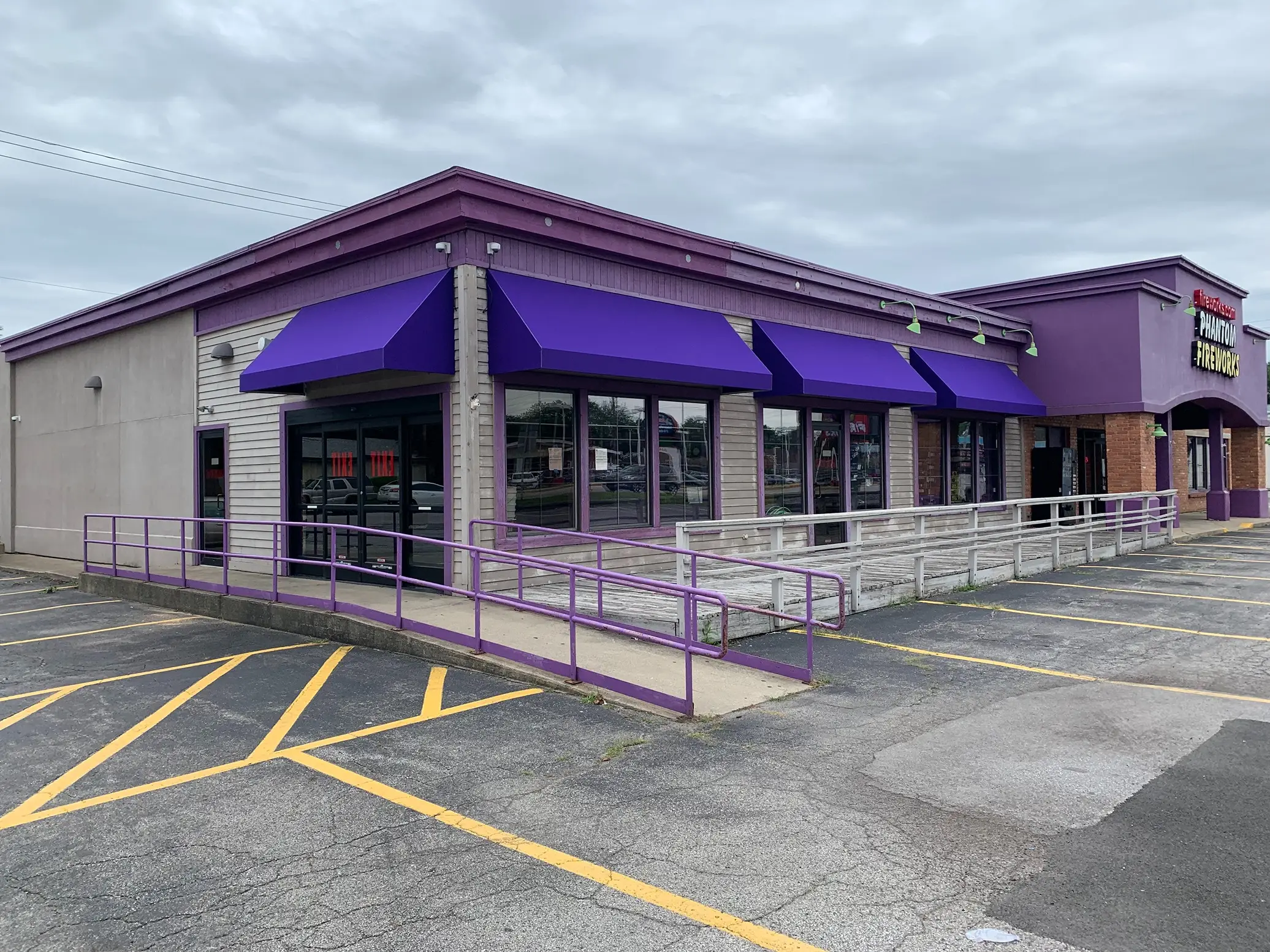 purple entrance and walkway canopies on building